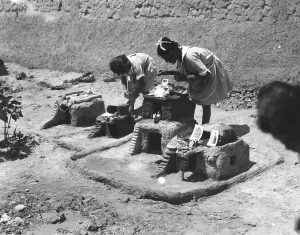 Children at Alexandropol built small playhouses in the large orphanage yard. The house on the far right has two small photographs or postcards as decorations.  