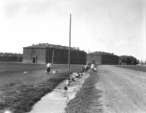 Boys swimming in an irrigation ditch near the barracks at Alexandropol's orphanage complex